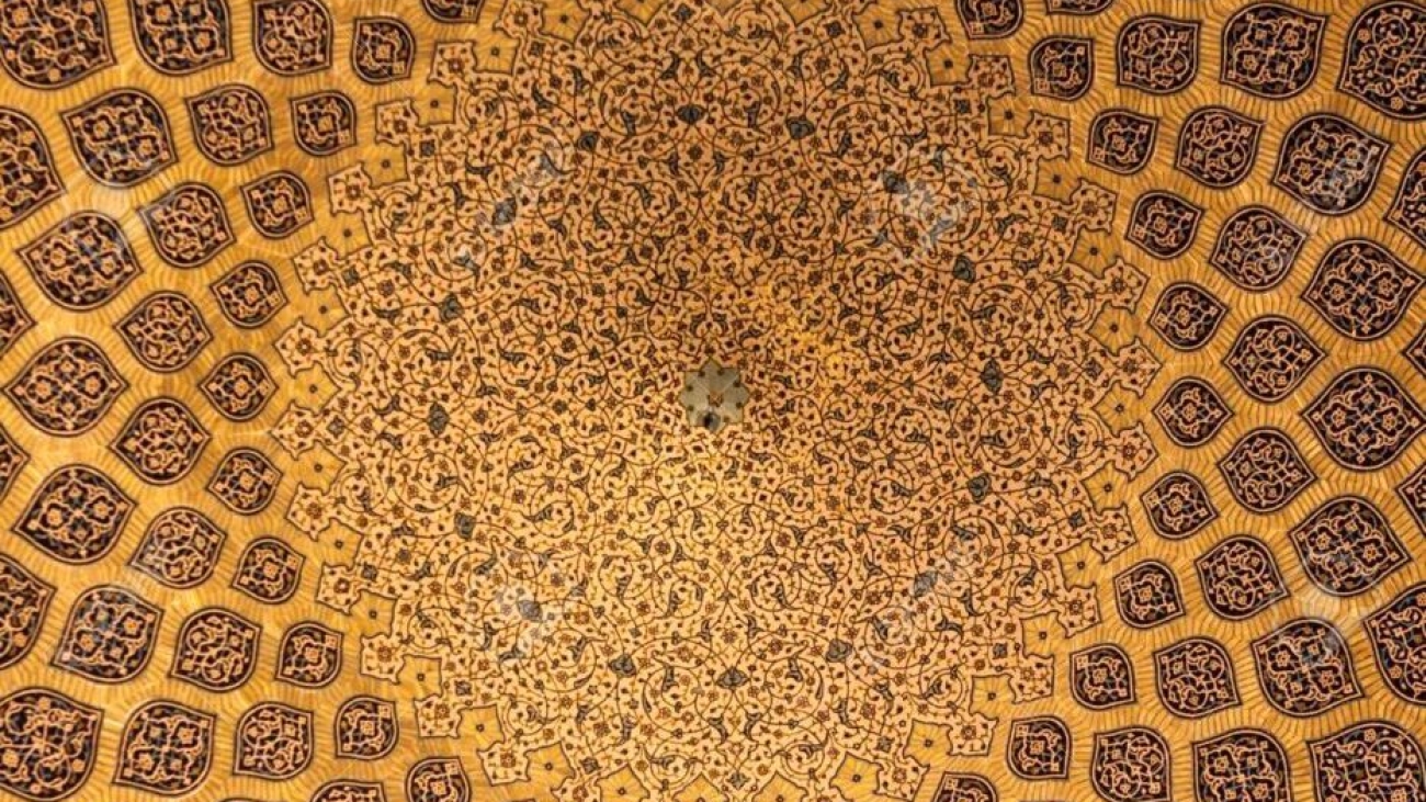 Islamic geometric pattern in Mosque. Islamic arabesque ornament on a mosque ceiling in Iran. Islamic ornament on a dome of a mosque.